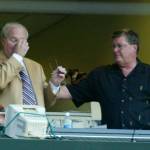 Mariners radio announcer Dave Neihaus (left) wipes his eyes at the end of Ron Fairlys last game as a full-time announcer at the end of the 2006 season. Fairly died Wednesday at the age of 81. (AP Photo/John Froschauer)