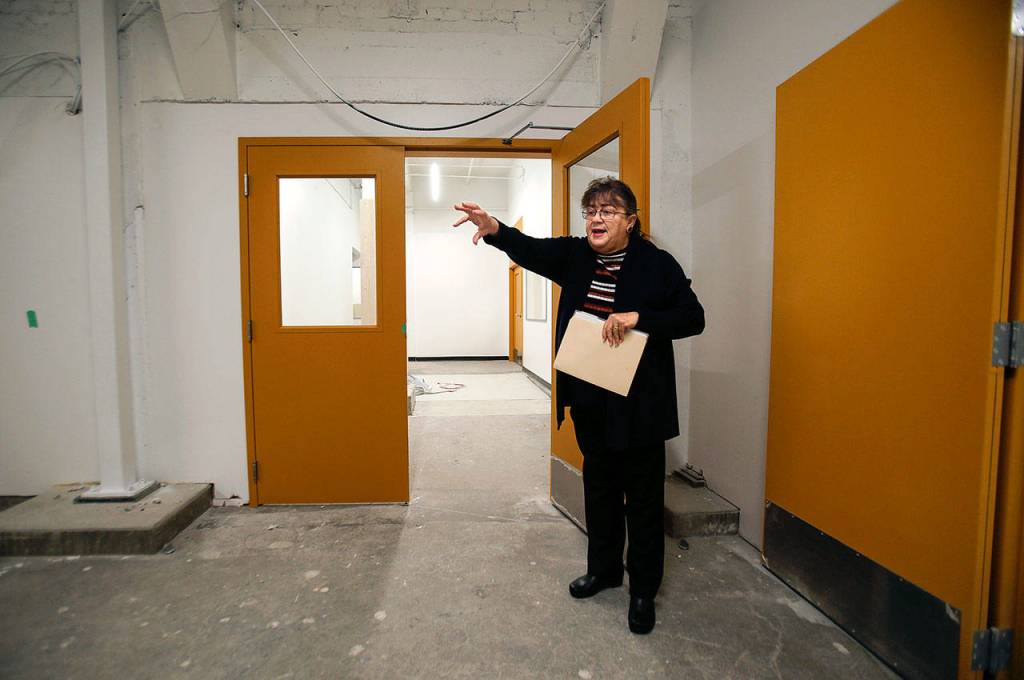 Earlier this year, Barbara George, executive director of the Everett Museum of History, points out a ramp that leads from the alley to the buildings lower level. Someday, Everetts antique bookmobile may drive or be rolled into the museum to be on long-term display. (Dan Bates / The Herald)