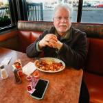 Richard Rauch, 67, of Edmonds, stops in for breakfast at Burgermaster on Evergreen Way in Everett Thursday before going to his job of taking kids to school. Rauch is a regular at the restaurant, which will close permanently on Sunday. (Dan Bates / The Herald)