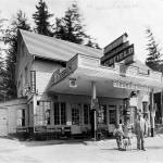 Keelers Korner was the first of a number of mom-pop grocery store/gas stations built between Seattle and Everett on U. S. Highway 99 after the thourougfare was completed in 1927. Pictured in this 1930 photograph are six-year old Frank Keeler and his father, Carl Keeler with the family dog. (Lynnwood-Alderwood Manor Heritage Association)