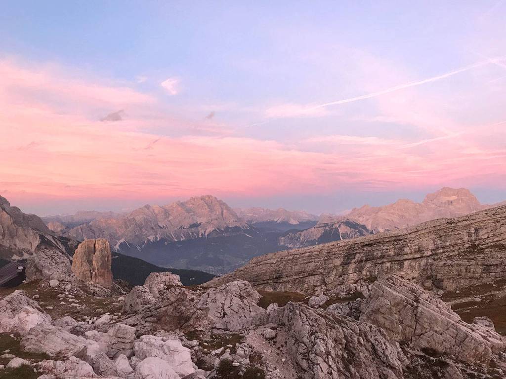 Looking west, the sun sets outside of Rifugio Averau, a Bavarian-style lodge for adventure tourists in the Italian Dolomites. (Kristina Ciari)