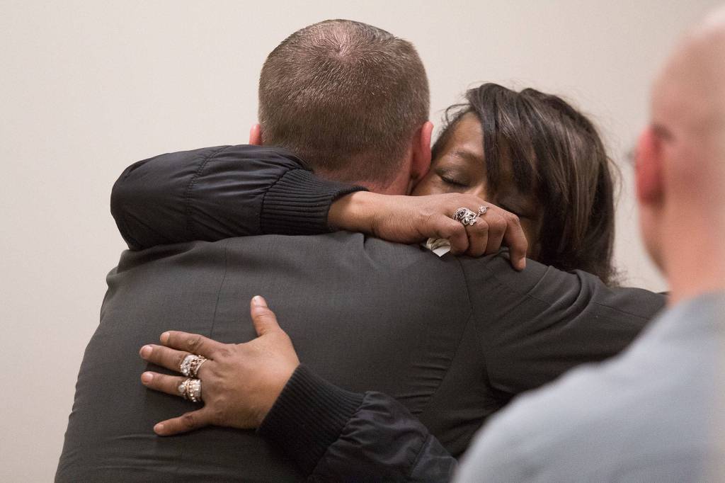 Phillipa Evans-Lopezs mother, Kris Evans, hugs Detective Brad Walvatne after Anthony Garver was sentenced to 32 years and one month in prison for the murder of Evans-Lopez. (Andy Bronson / The Herald)