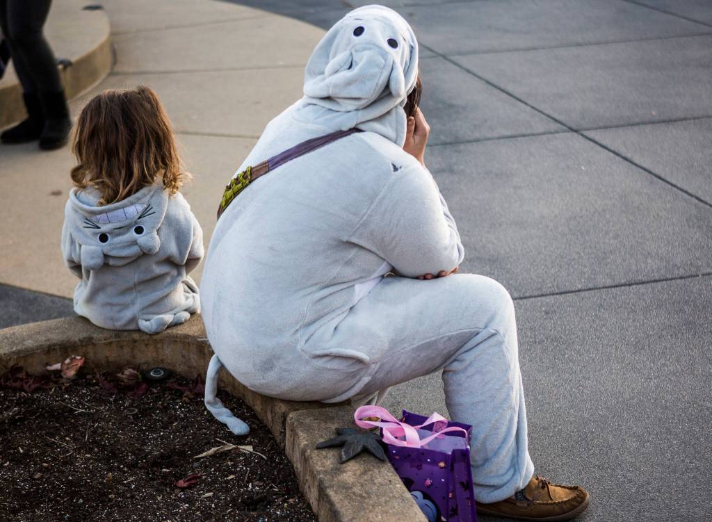 Two Totoros sit next to each other in Wetmore Plaze during Downtown Trick-or-Treating on Oct. 31, 2019 in Everett, Wash. (Olivia Vanni / The Herald)