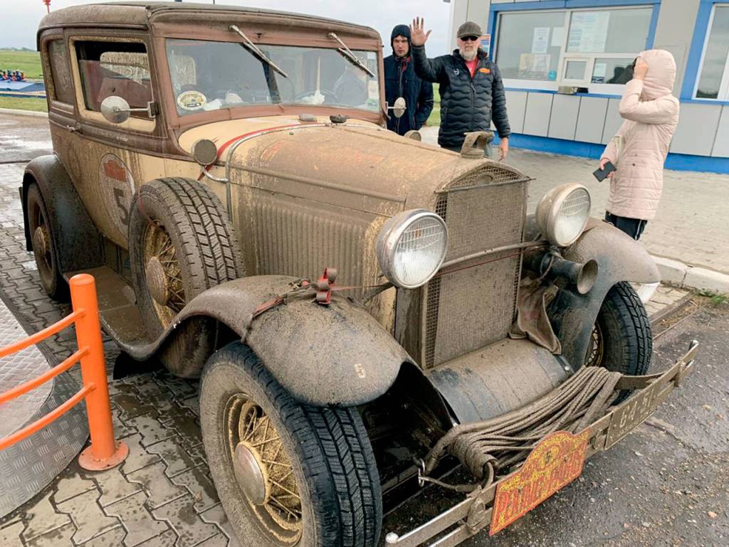 Slogging through farm trails between Novosibirsk, Russia, and Pavlodar, Kazakhstan left the car and engine covered in mud. (Lee Harmon)