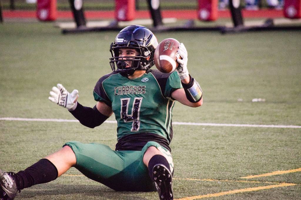 Junior wide receiver Landyn Olson lifts the ball up after catching the ball in the end zone for Getchell against Lynnwood on Friday, Nov. 1 at Quil Ceda Stadium in Marysville. (Katie Webber / The Herald)