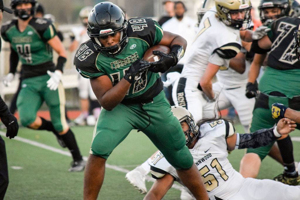 Junior fullback Cheron Smith runs for a first down against Lynnwood on Friday, Nov. 1 at Quil Ceda Stadium in Marysville. (Katie Webber / The Herald)