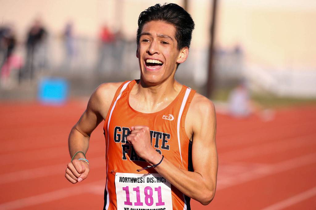 Granite Falls Isaac Cortes is all smiles at the finish line after taking first Saturday during the District 1 Cross Country Championship at South Whidbey High School in Langley on Saturday. (Kevin Clark / The Herald)