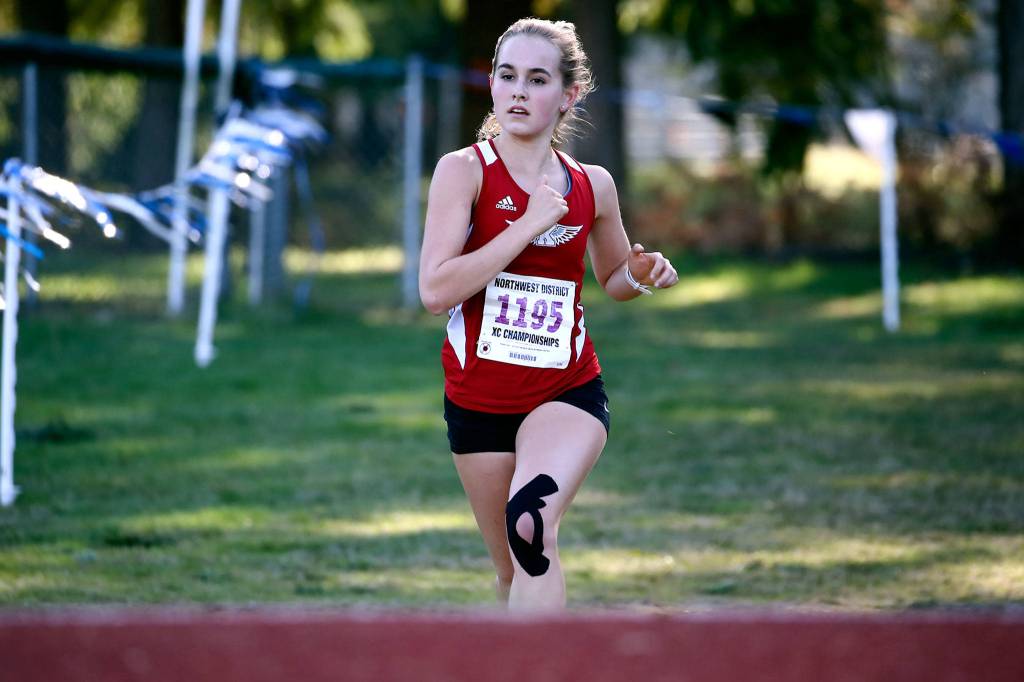 Kings Naomi Smith finishes first in the 1A division Saturday during the District 1 Cross Country Championship at South Whidbey High School in Langley on Saturday. (Kevin Clark / The Herald)