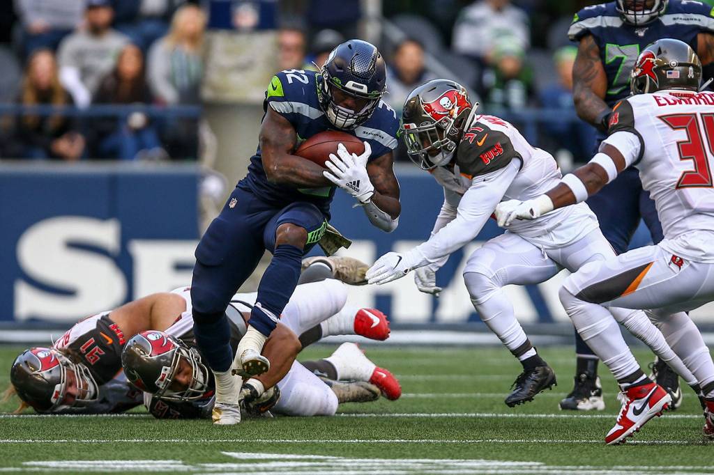 Seahawks Chris Carson rushes against the Buccaneers Sunday afternoon against the Buccaneers at CenturyLink Field in Seattle on November 3, 2019. (Kevin Clark / The Herald)