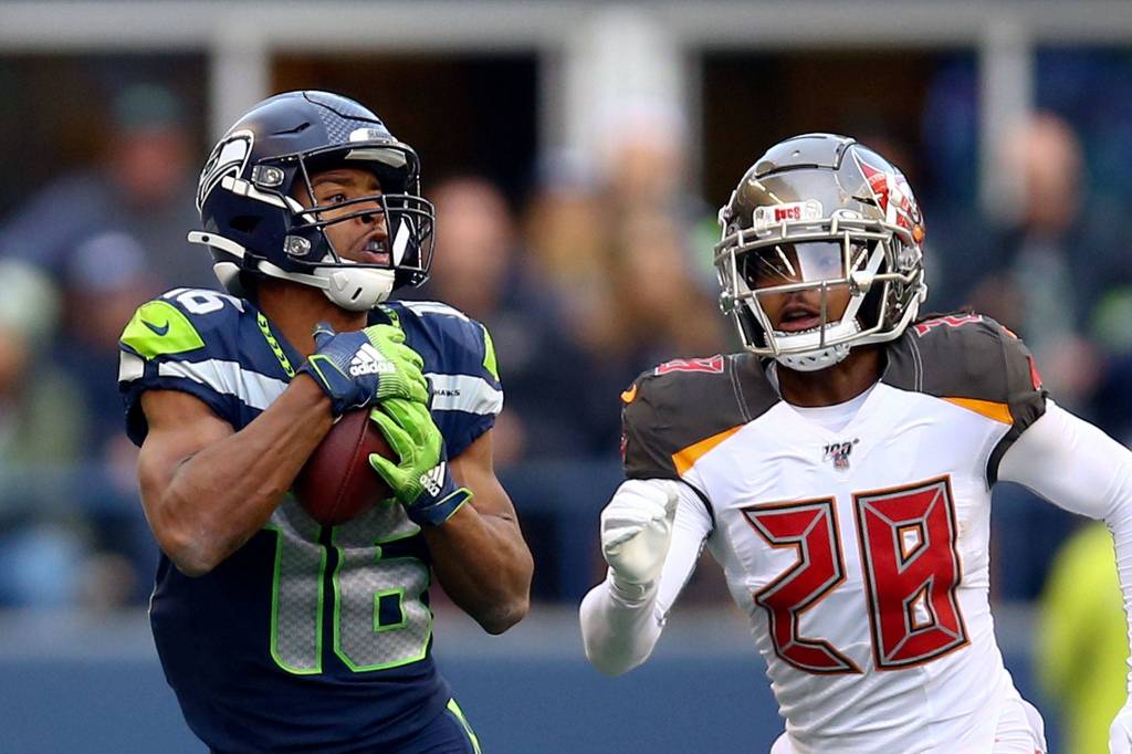 Seahawks Tyler Lockett makes a key reception with Buccaneers Vernon Hargreaves III trailing Sunday afternoon against the Buccaneers at CenturyLink Field in Seattle on November 3, 2019. (Kevin Clark / The Herald)