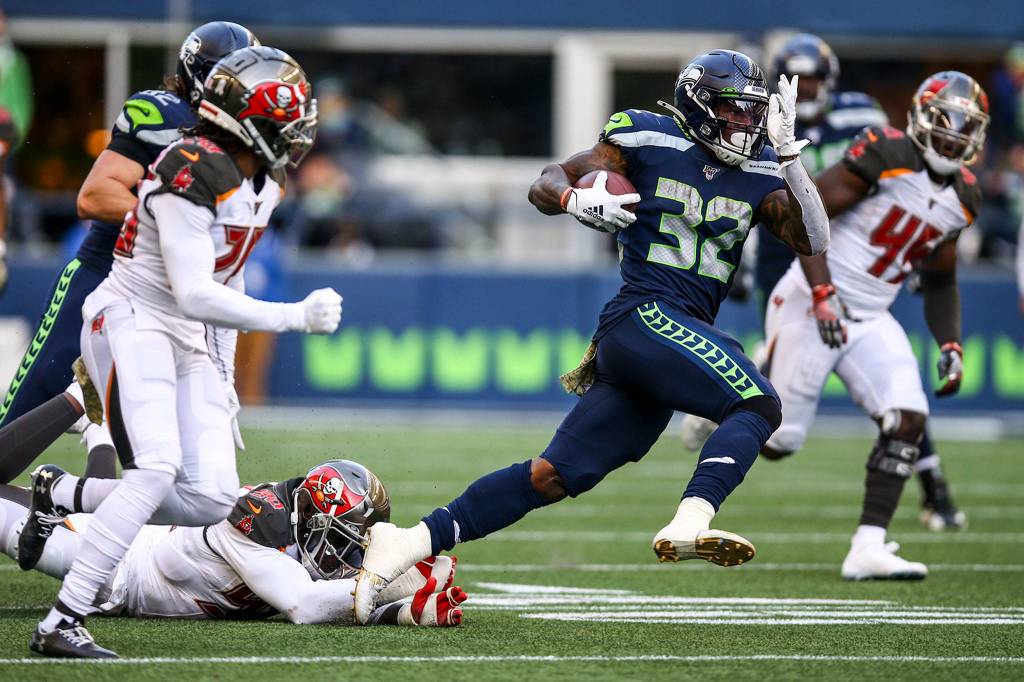 Seahawks Chris Carson rushes against the Buccaneers Sunday afternoon against the Buccaneers at CenturyLink Field in Seattle on November 3, 2019. (Kevin Clark / The Herald)