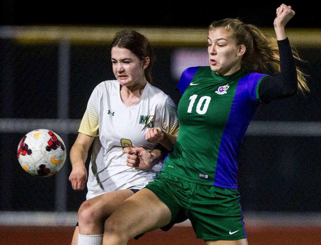 Edmonds-Woodways AJ Martineau fights for the ball during the district semifinal game on Nov. 5, 2019 in Edmonds, Wash. (Olivia Vanni / The Herald)