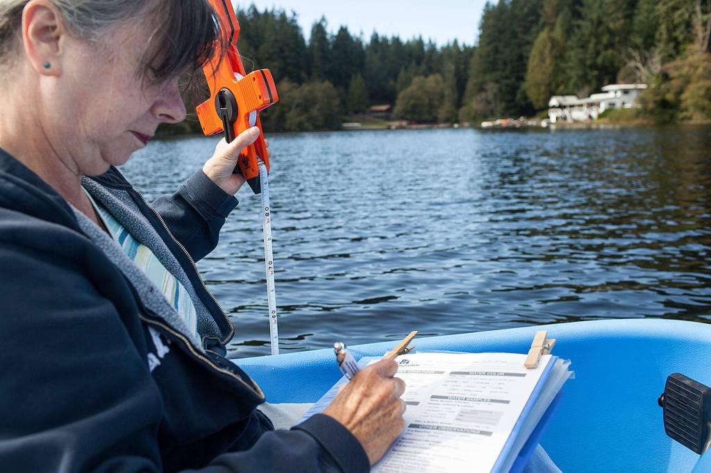 Deb Kocher is one of 73 volunteers monitoring 31 lakes through a Snohomish County Surface Water Management program. (Lizz Giordano / The Herald)