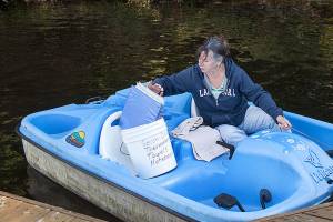 Twice a month Deb Kocher paddles to the middle of Lake Crabapple to collect data. (Lizz Giordano / The Herald)