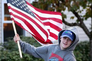 Flags in hand, kids carry a star-spangled message for vets