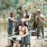 Greg Doering sits in a seat as he and his squad pull security duty while recovering parts from a downed helicopter in Vietnam. (Photo courtesy of Greg Doering)