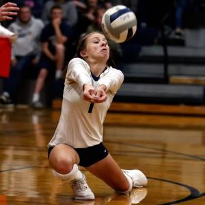 Arlingtons Taylor Helle digs a ball during a Wesco 3A/2A match against Oak Harbor on Oct. 24 at Arlington High School. Helle and the Eagles will play the winner of Thursdays play-in match between Lynnwood and Squalicum in the 3A Northwest District Tournament next Tuesday at 7 p.m. in Arlington. (Kevin Clark / The Herald)