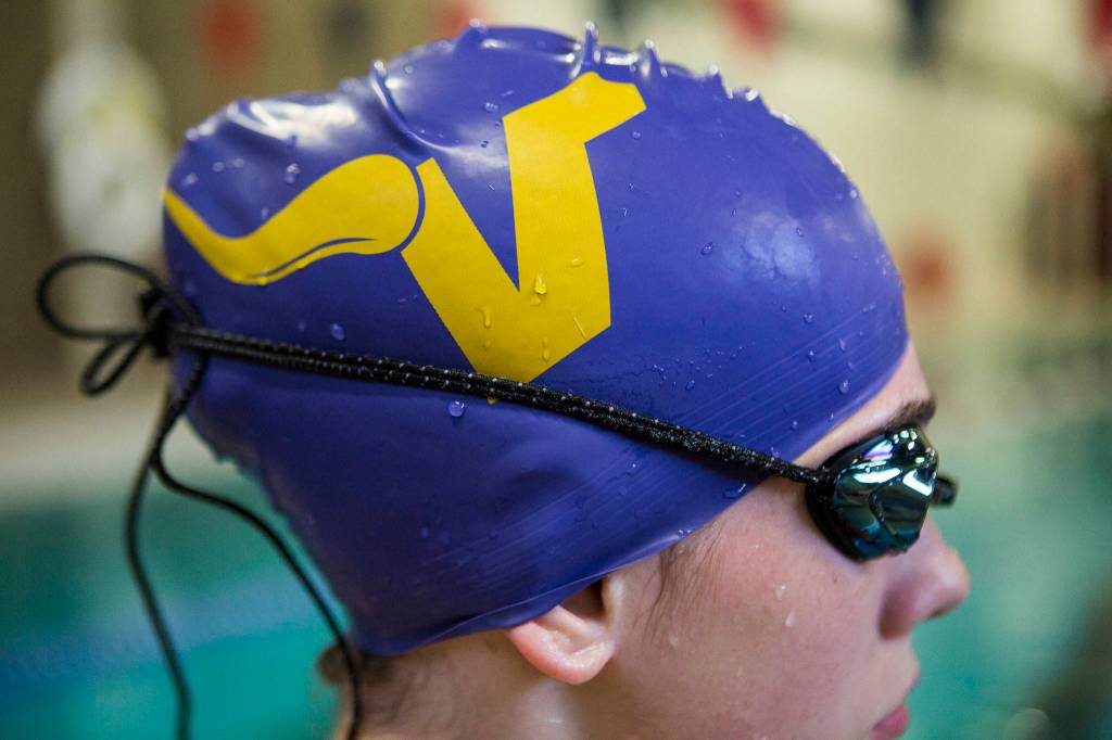 Bailey Kingsbury wears a Lake Stevens swim cap during swim practice at Explorer Middle School on Nov. 6, 2019 in Everett, Wash. (Olivia Vanni / The Herald)
