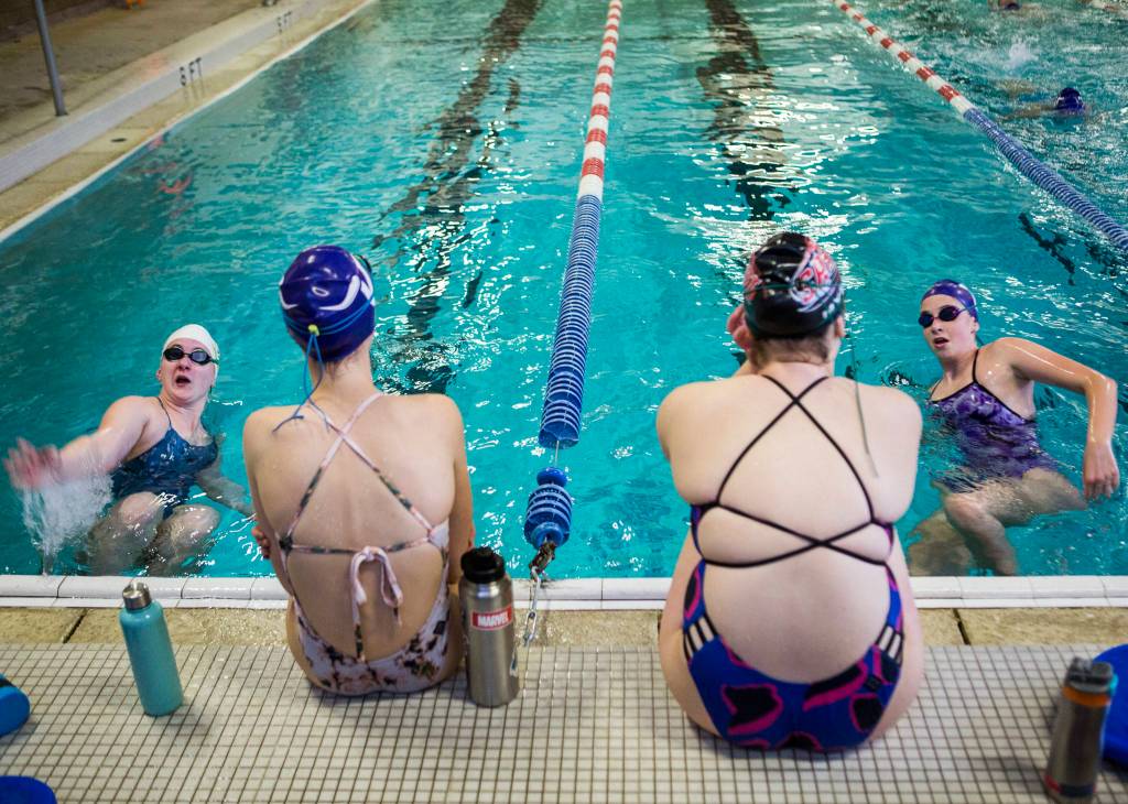 Lake Stevens Grace Brown, left, and Autumn Marlatt, right, kick off the wall during swim practice at Explorer Middle School on Nov. 6, 2019 in Everett, Wash. (Olivia Vanni / The Herald)