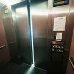 Doors start to open on an elevator in Everett on Thursday. (Sue Misao / The Herald)