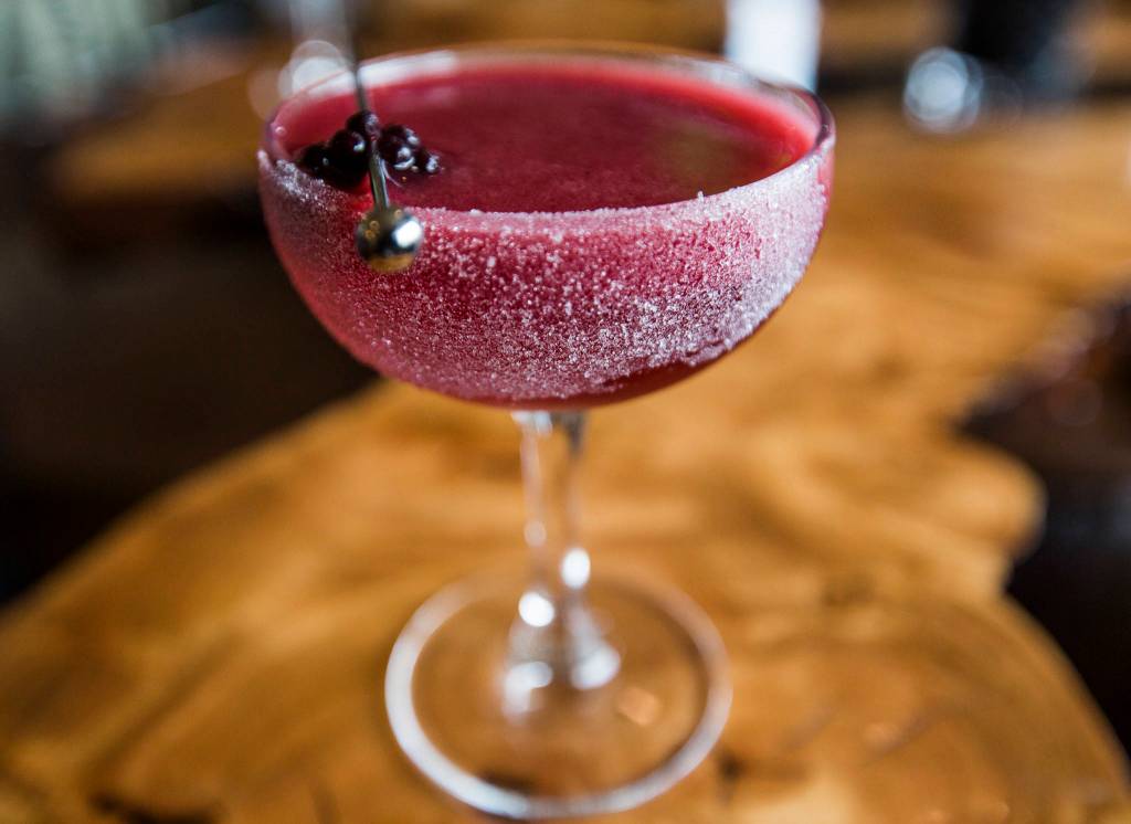 A Black Rose, one of the most popular cocktails at Kelnero, is made with vodka, blackberry juice, lemon, orange curacao, a rose spritz and a crushed sugar rim. (Olivia Vanni / The Herald)