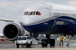 FILE - In this Friday, March 31, 2017, file photo, Boeing employees walk the new Boeing 787-10 Dreamliner down towards the delivery ramp area at the companys facility in South Carolina after conducting its first test flight at Charleston International Airport in North Charleston, S.C. The Boeing Co. reports earnings, Wednesday, April 26, 2017. (AP Photo/Mic Smith)