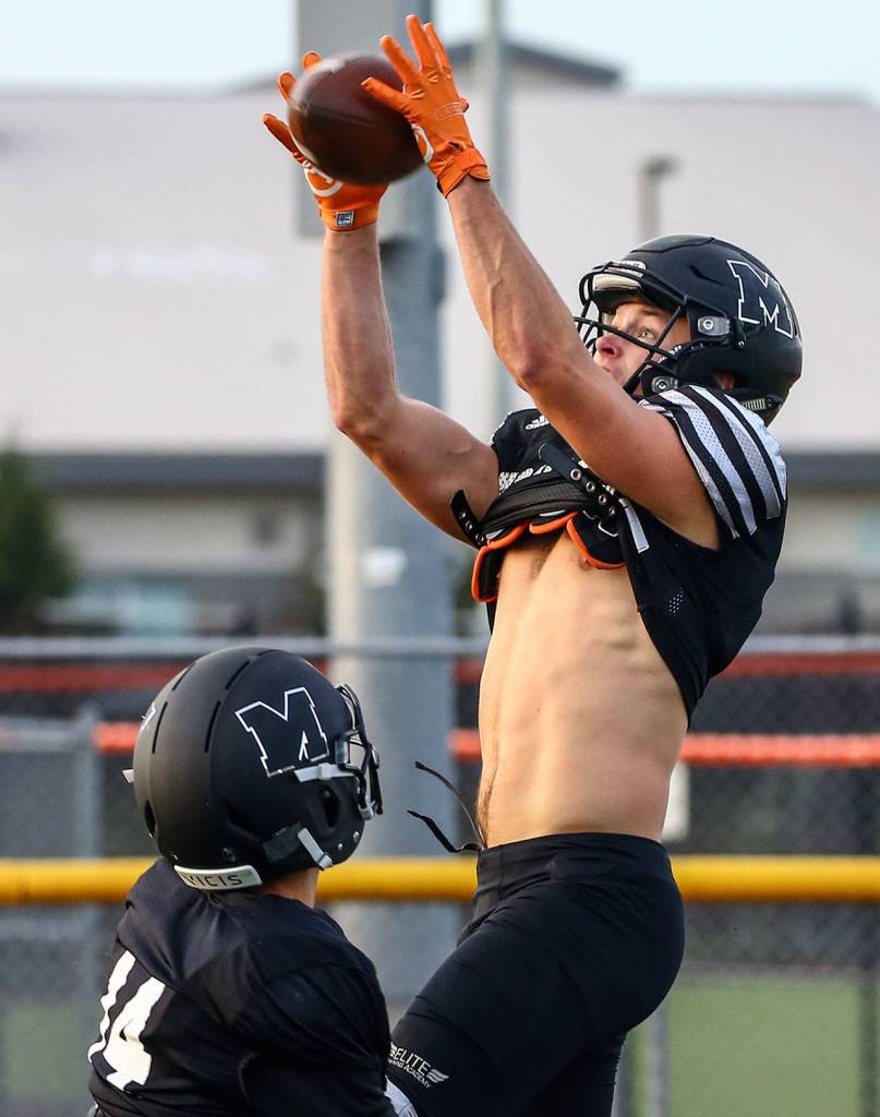 Efton Chism makes a catch during practice Wednesday evening at Monroe High School on November 6, 2019.(Kevin Clark / The Herald)