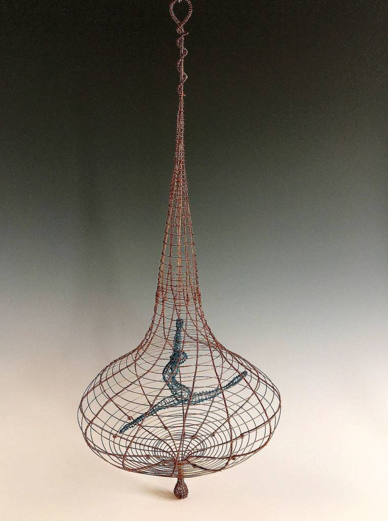 This sculpture called Blue Spinner is by Chris Wooten, a member of the Seattle Metals Guild which has scheduled a holiday trunk show Nov. 23 and 24 at the Schack Art Center.