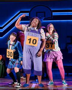 Arika Matoba (Marcy Park), Sarah Russell (Logainne Schwartzandgrubenniere) and Taylor Niemeyer (Olive Ostrovsky) in a scene from The 25th Annual Putnam County Spelling Bee. (Mark Kitaoka / Village Theatre)                                From left: Arika Matoba, Sarah Russell, and Taylor Niemeyer, members of the cast of The 25th Annual Putnam County Spelling Bee at Village Theatre in Everett. (Mark Kitaoka)