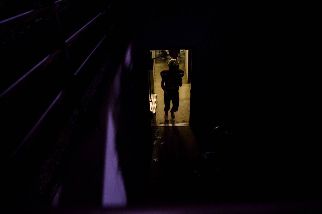 A player makes his way out of the locker room at half time during a 2A playoff game against Liberty on Nov. 8, 2019 in Arlington, Wash. (Olivia Vanni / The Herald)