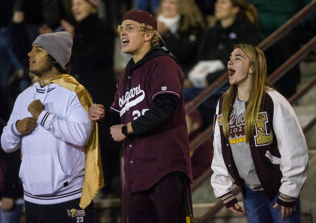 Fans cheer after the interception during a 2A playoff game against Liberty on Nov. 8, 2019 in Arlington, Wash. (Olivia Vanni / The Herald)