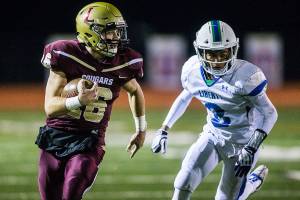 Lakewoods Jared Taylor runs the ball during a 2A playoff game against Liberty on Nov. 8, 2019 in Arlington, Wash. (Olivia Vanni / The Herald)