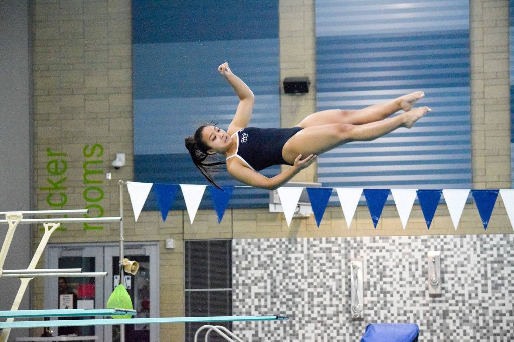 Glacier Peaks Ryzele Lagdaan competes in the girls one meter diving of the 4A Girls Northwest District Championship on Nov. 9 at the Snohomish Aquatic Center. Lagdaan won with a final score of 392.20. (Katie Webber / The Herald)