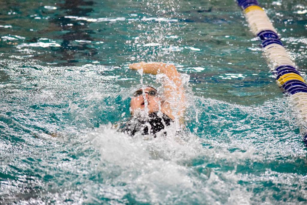 Jacksons Mia Chang swims in the girls 100 yard backstroke of the 4A Girls Northwest District Championship on Nov. 9 at the Snohomish Aquatic Center. Chang won with a time of 54.56, which is a meet record. (Katie Webber / The Herald)