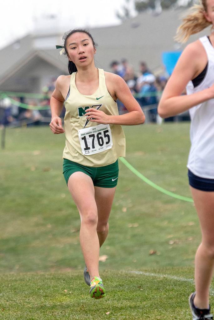 Marysville Getchell junior Jasmine Nguyen finishes in 15th place during the Class 3A girls WIAA state cross country championships in Pasco, Wash., on Saturday, Nov. 9, 2019, at Sun Willows Golf Course. (TJ Mullinax/The Herald)