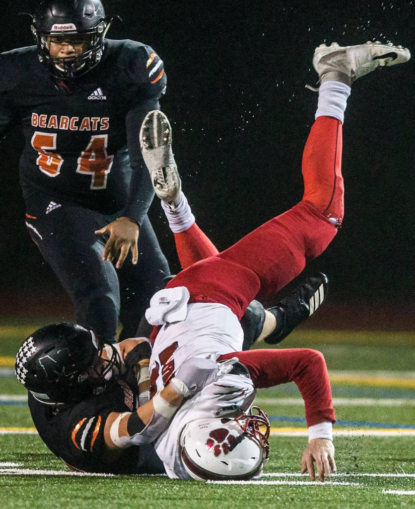 Mount Sis Clay Millen is tackled by Monroes Blake Rybar during the 4A playoff game against Mount Si on Nov. 9, 2019 in Monroe, Wash. (Olivia Vanni / The Herald)