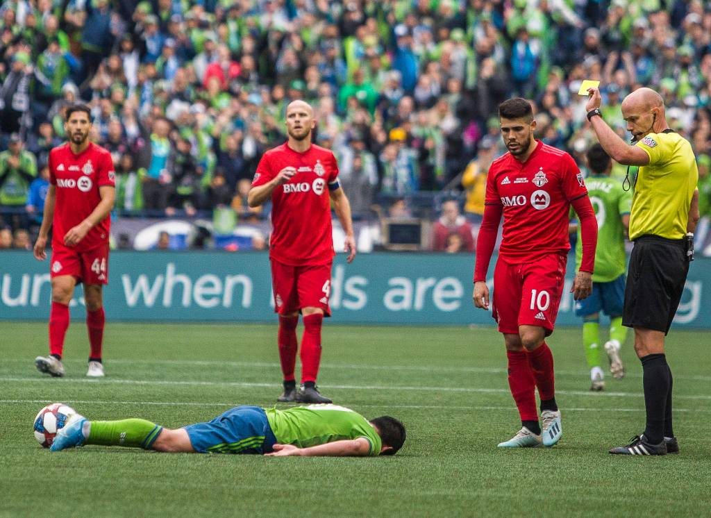 A yellow card is given to Toronto midfielder Alejandro Pozuelo after a tackle during the MLS Cup on Nov. 10, 2019 in Seattle, Wash. (Olivia Vanni / The Herald)