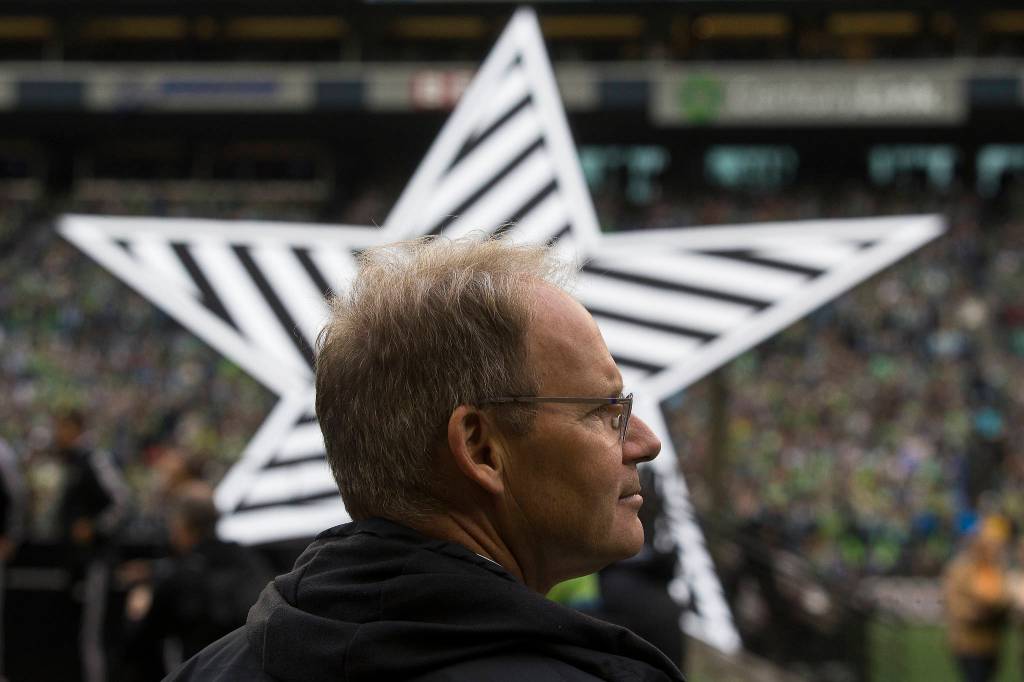 Seattle Sounders head coach Brian Schmetzer waits for the MLS CUP trophy to be presented after the Seattle Sounders beat Toronto FC 3-1 to win the MLS Cup at CenturyLink Field on Sunday, Nov. 10, 2019 in Seattle, Wash. (Andy Bronson / The Herald)