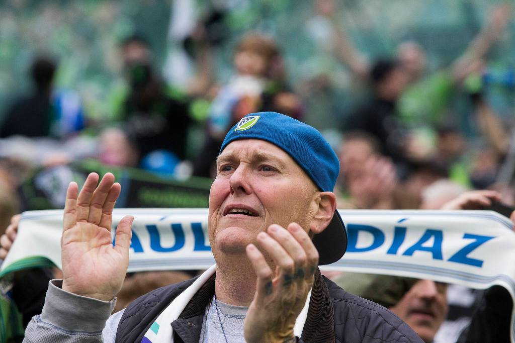 A fan tears up after the Seattle Sounders beat Toronto FC 3-1 to win the MLS Cup at CenturyLink Field on Sunday, Nov. 10, 2019 in Seattle, Wash. (Andy Bronson / The Herald)