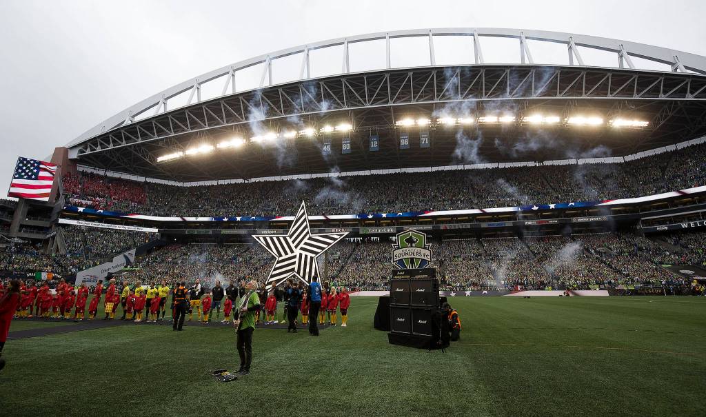 Pearl Jam guitarist Mike McCready plays the National Anthem before the Seattle Sounders beat Toronto FC 3-1 to win the MLS Cup at CenturyLink Field on Sunday, Nov. 10, 2019 in Seattle, Wash. (Andy Bronson / The Herald)