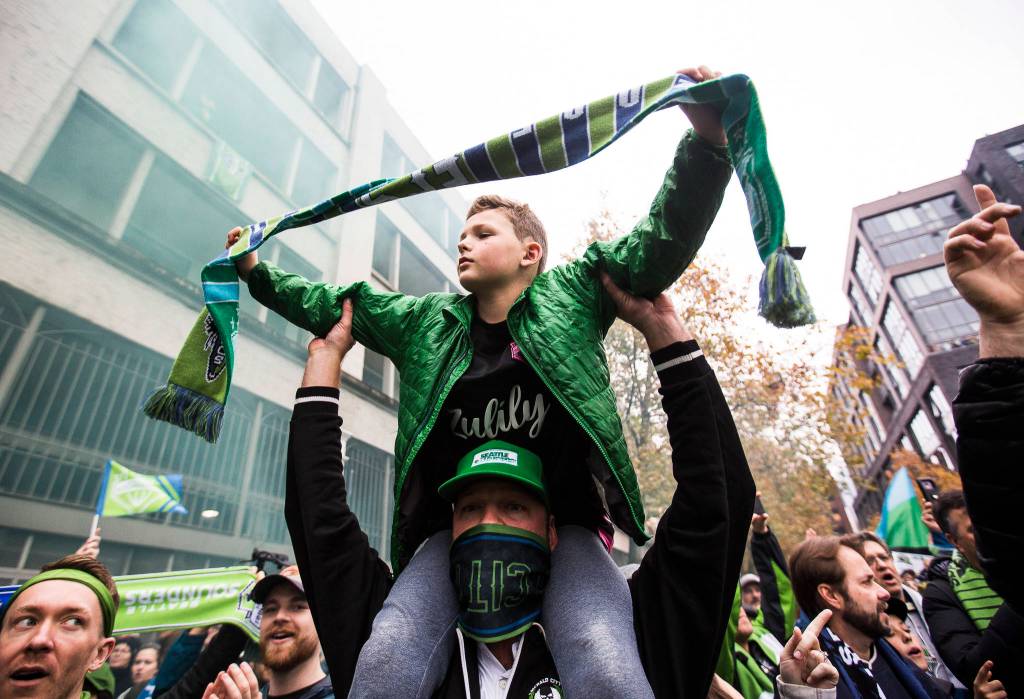 Sounders fans march down Occidental Ave before the MLS Cup on Nov. 10, 2019 in Seattle, Wash. (Olivia Vanni / The Herald)