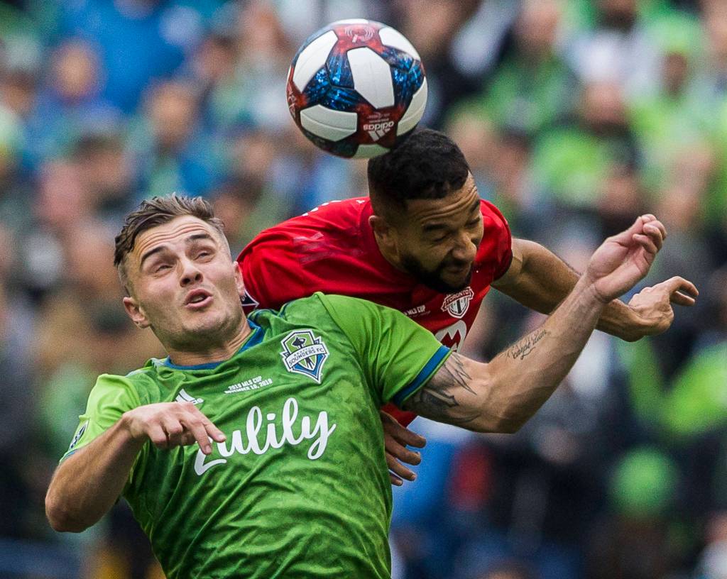 Sounders Jordan Morris jumps to head the ball during the MLS Cup on Nov. 10, 2019 in Seattle, Wash. (Olivia Vanni / The Herald)