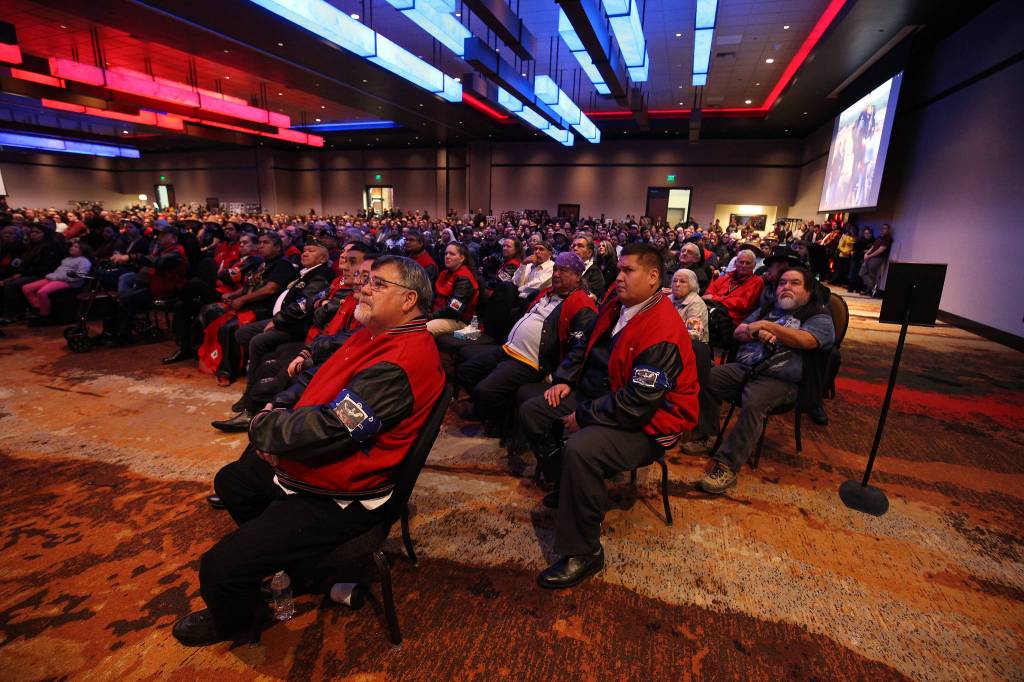 In was standing room only as family and guests watch a video showing the life of Tulalip Tribes longest serving board member and chairman Stan Jones Sr. on Tuesday in Tulalip. (Andy Bronson / The Herald)