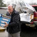Gary Ray, then pastor of the Oso Community Chapel, carries chocolate bars for victims of the Oso mudslide on March 27, 2014, near Oso. (Jordan Stead, seattlepi.com, file)