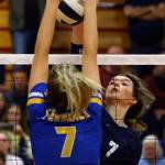 Arlingtons Arianna Bilby (right) attempts a kill over Ferndales Malia Honrud Thursday evening at Marysville-Pilchuck High School on November 14, 2019. (Kevin Clark / The Herald)