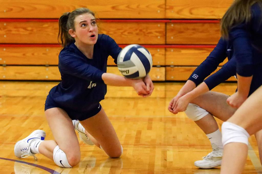 Arlingtons Malia Shepherd makes a dig against Ferndale Thursday evening at Marysville-Pilchuck High School on November 14, 2019. (Kevin Clark / The Herald)