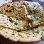 The aloo paratha from 5 Rivers in Everett is unleavened layered whole-wheat bread stuffed with potatoes, onions and spices. (Sharon Salyer/ The Herald)