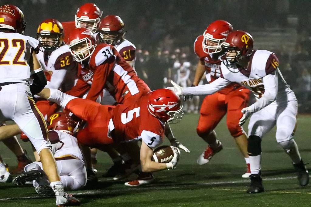 Marysville Pilchucks Dylan Carson falls across the goal line in overtime Friday evening at Quil Ceda Stadium in Marysville on November 15, 2019. Marysville Pilchuck won 37-30 in overtime. (Kevin Clark / The Herald)