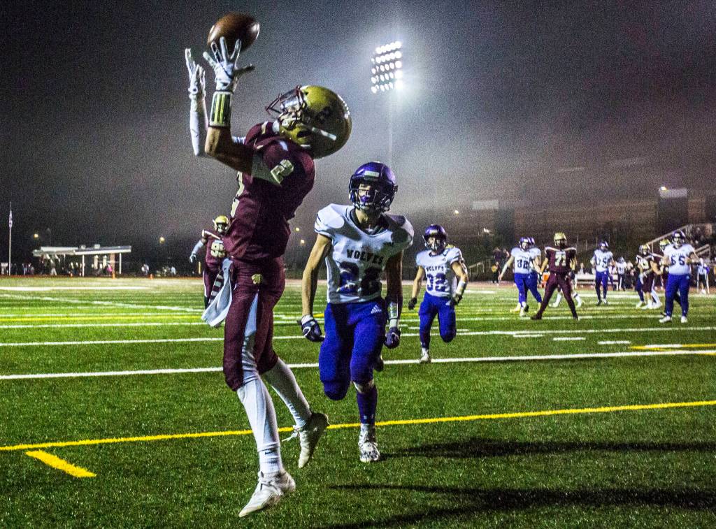 Lakewoods Carson Chrisman makes a touchdown reception during a 2A state playoff game on Friday in Arlington. (Olivia Vanni / The Herald)