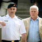 In this June 27 photo, Maj. Mathew Golsteyn (left), a former Army Special Forces soldier, leaves the Fort Bragg courtroom facility with his civilian lawyer, Phillip Stackhouse (right) after an arraignment hearing. (Andrew Craft/The Fayetteville Observer via AP)